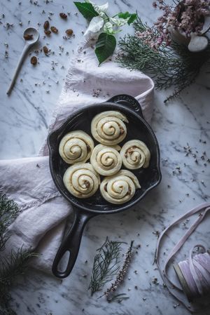 Fresh cinnamon rolls on table
