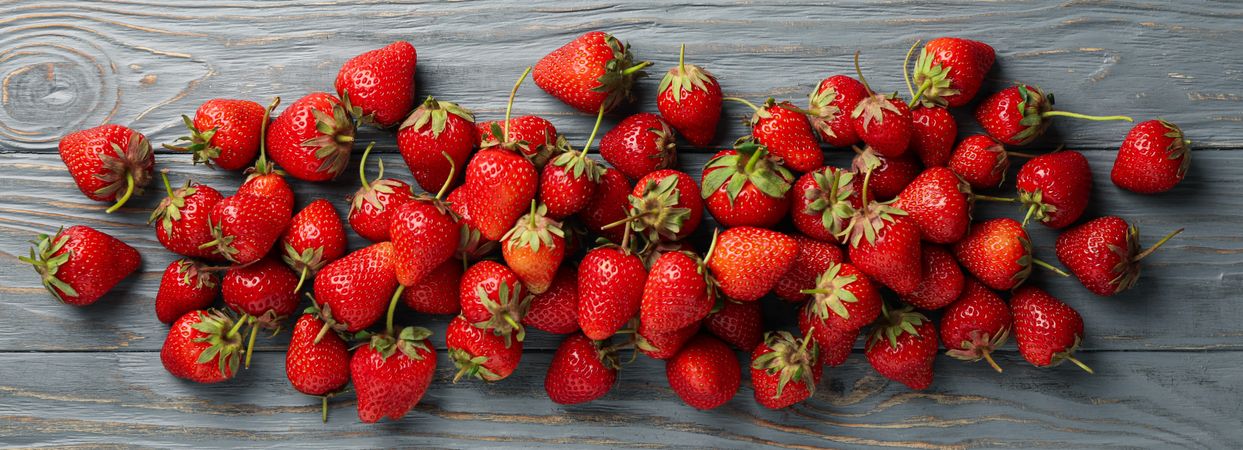 Tasty strawberry on wooden background, top view. Summer berry