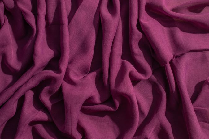 Soft purple fabric wavy crumpled background abstract.