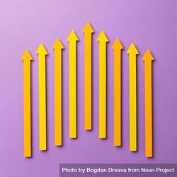 Yellow paper arrows on purple background 4mDPz5