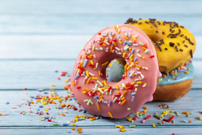 Delicious assorted colorful donuts on the table.
