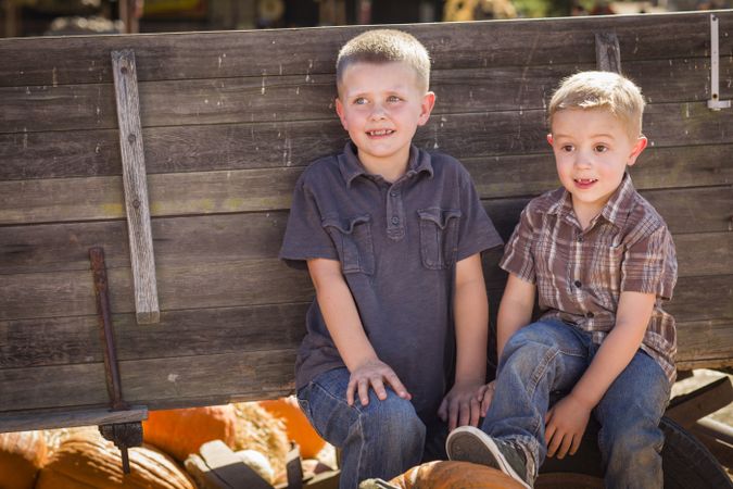 Two Boys Having Fun at the Pumpkin Patch