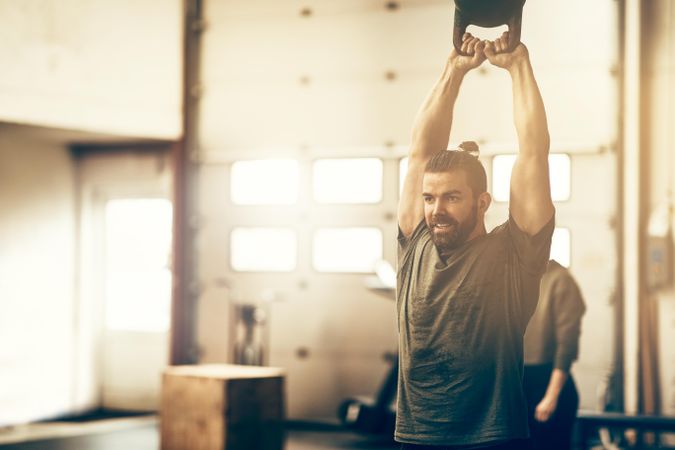 Man performing a workout with kettlebells