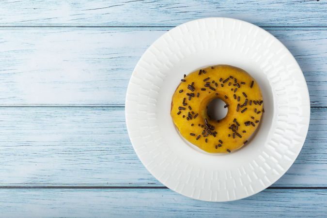 Delicious assorted colorful donuts on the table.