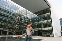 Cheerful couple having fun and hugging on street in downtown