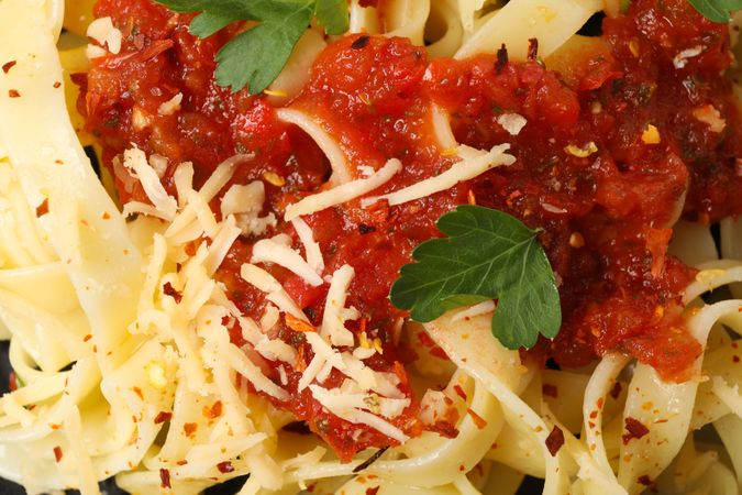 Tasty pasta on whole background, close up