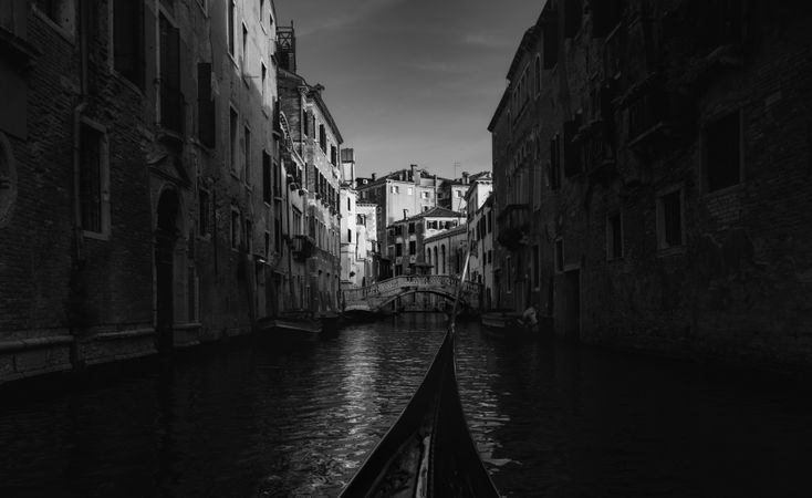 Golden bird gondola floating between colored houses