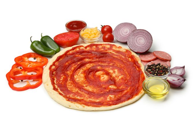 Dough and ingredients for cooking pizza isolated on blank background