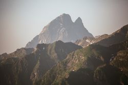 Majestic mountains range in clouds