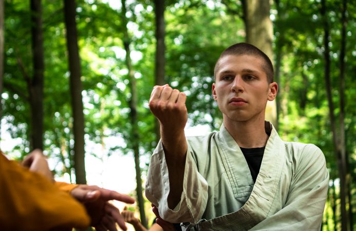 woman practicing martial arts in garden