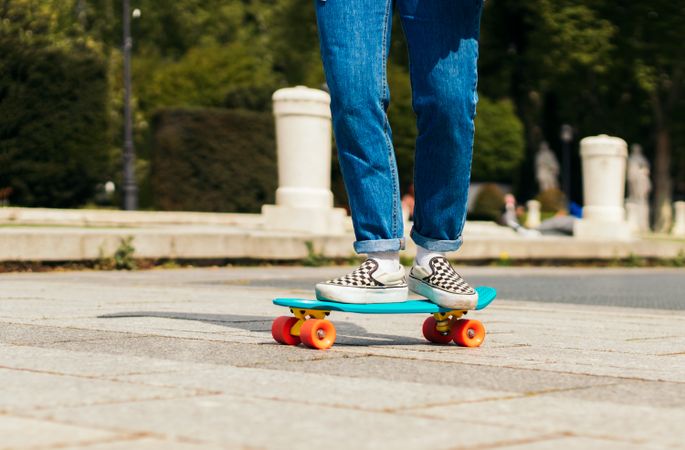woman skating on a city square. close-up