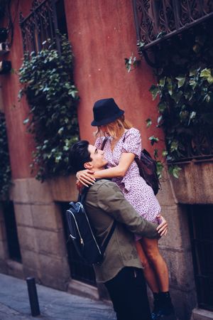 Happy couple having fun while walking in town