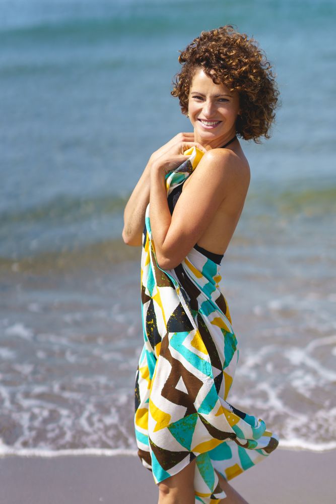 Woman in sarong at beach