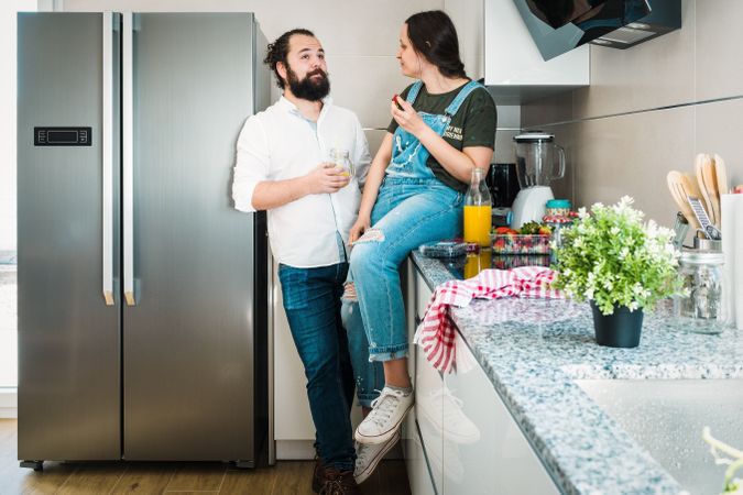 Couple eating healthy food in kitchen
