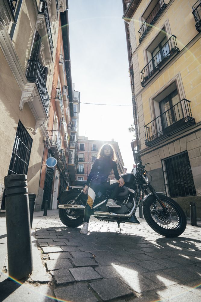Young woman in custom motorbike