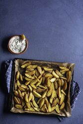 Oven roasted potatoes on blue table