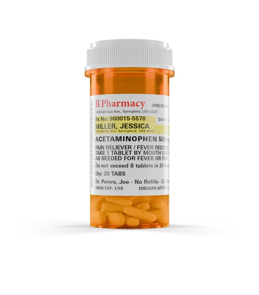 Acetaminophen Prescription Medicine Bottle and Pills Isolated on a blank Background.