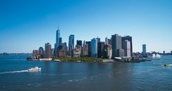 Aerial Photo of Manhattan Island with Office and Apartment Buildings. Hudson River Scenery with Yachts, Boats, One World Trade Center Skyscraper in the Middle of Skyline
