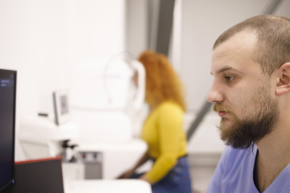 Side view of male doctor in eye clinic