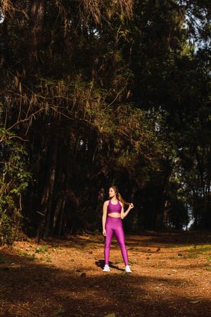 Young woman in forest path