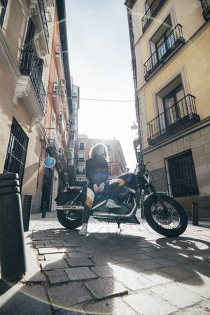 Young woman in custom motorbike