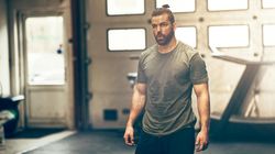 Serious man pausing during a workout