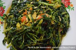 Top view of plate of cooked greens side dish bDjPkK