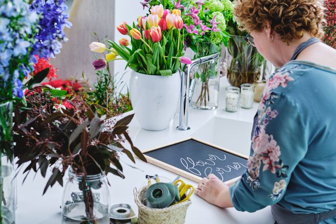 Unrecognizable woman working in floral shop