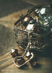 Christmas tree decorations in wire box, close up