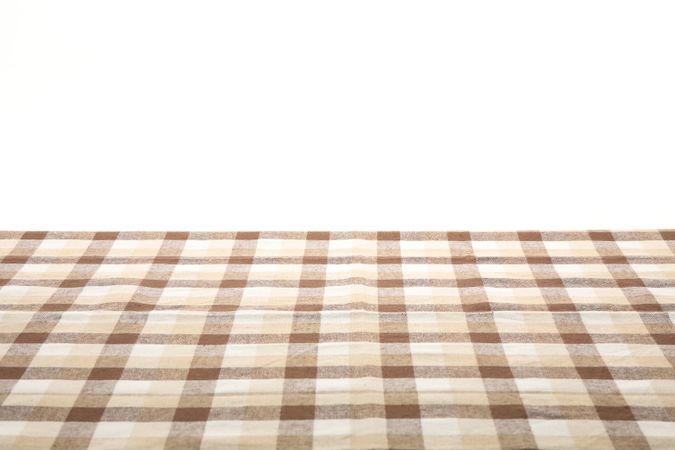 Checkered napkin against studio background, space for text