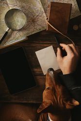Top view close up adventure traveler writes plan of new trip
