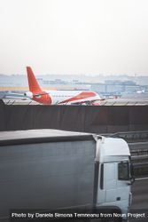 Airplane on runway and truck in motion blur 5w9vvb