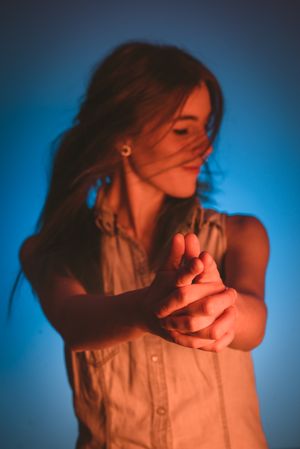 woman showing gun gesture