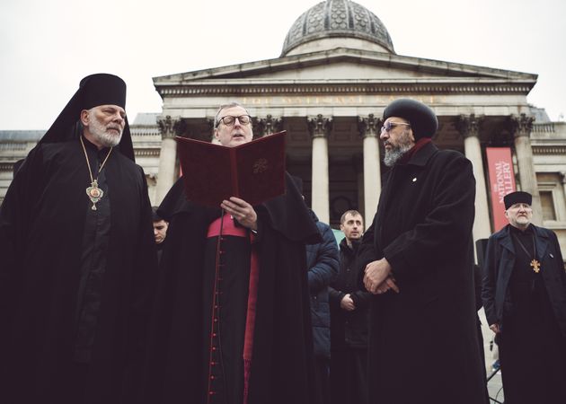 London, England, United Kingdom - March 5 2022: Three men in religious garbs speaking at protest