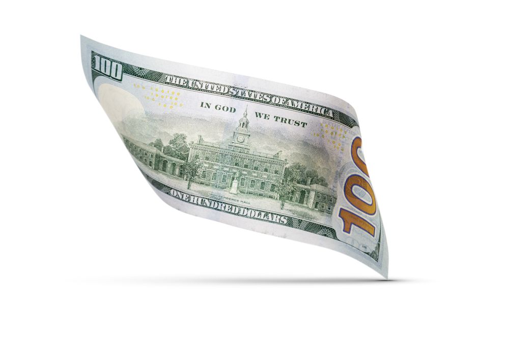 One Hundred Dollar Bill Floating Down To Surface with Drop Shadow