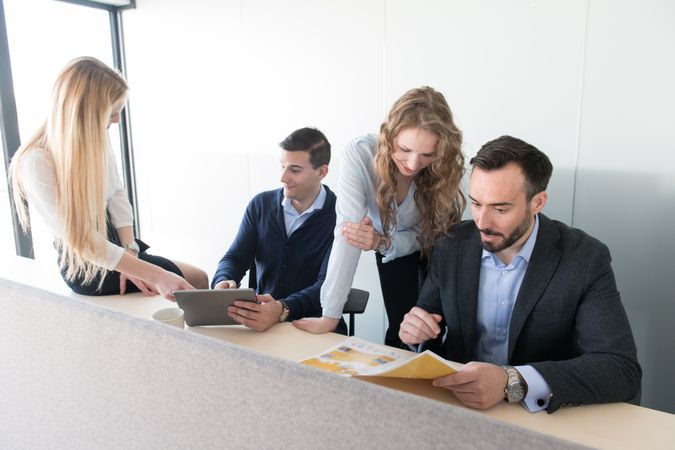 Smiling coworkers inside of office
