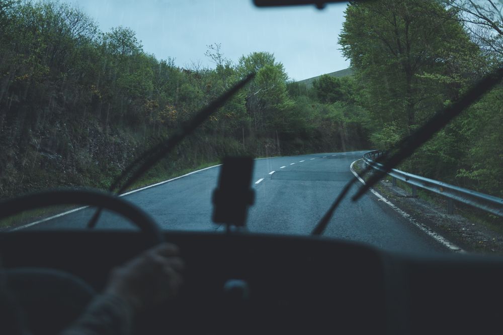 View of inside car empty road in countryside