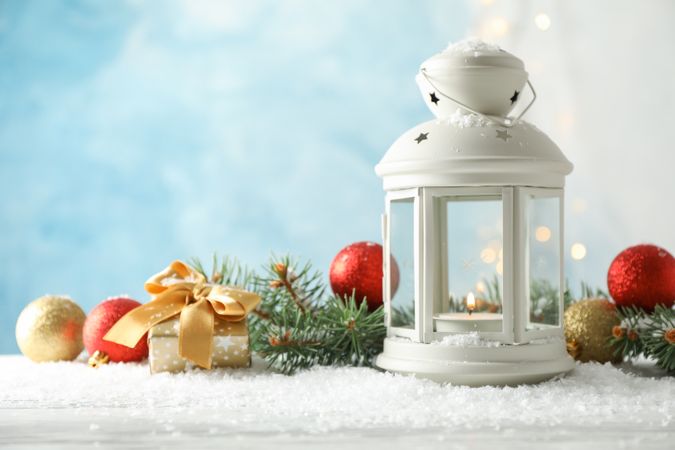 Christmas lantern on decorated background, space for text