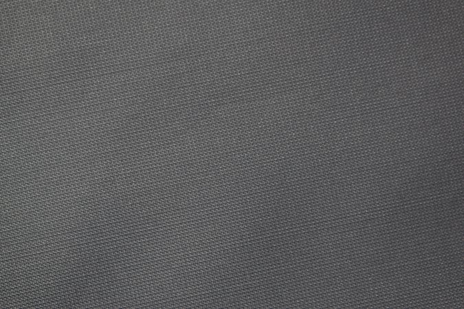 Flat view detailed dark grey silky fabric background texture.
