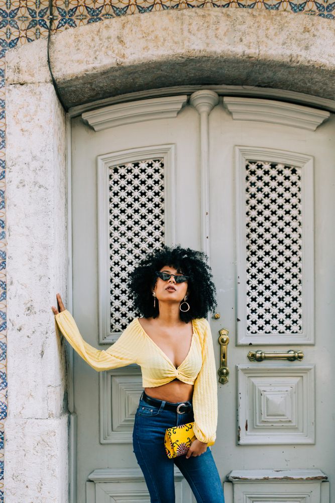 Fashionable female by gray door