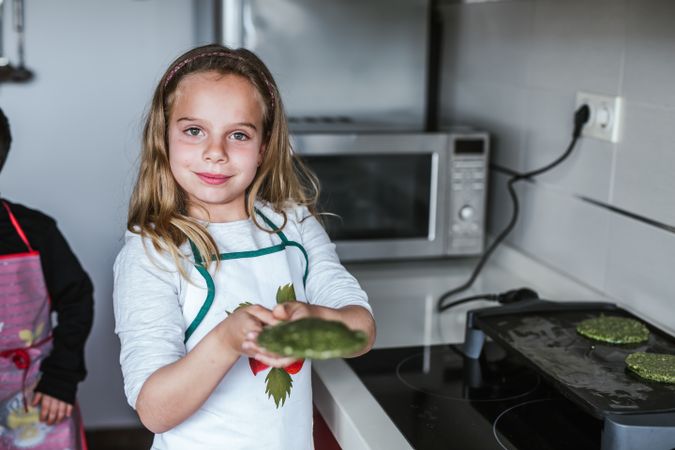Smiling girl with vegan cutlets