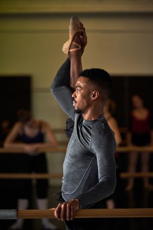 Male dancer in a warm-up and dancing in a ballet class