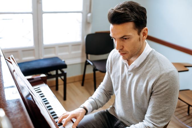 Man playing piano in studio