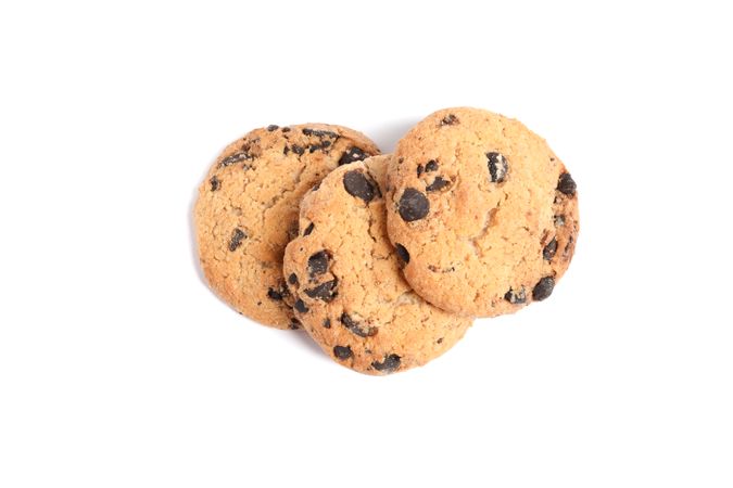 Delicious chocolate chip cookies on plain background