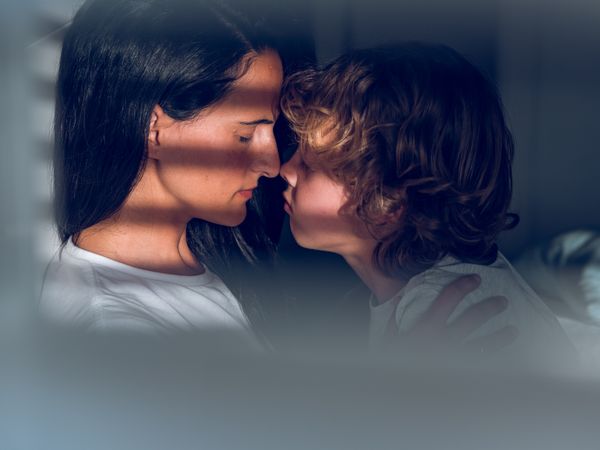 Mother and son touching noses