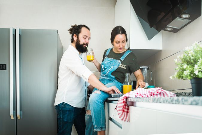 Couple eating healthy food in kitchen