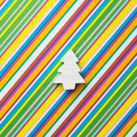 Light pine tree on diagonal stripped pattern background