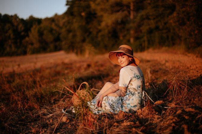 Woman sitting in field