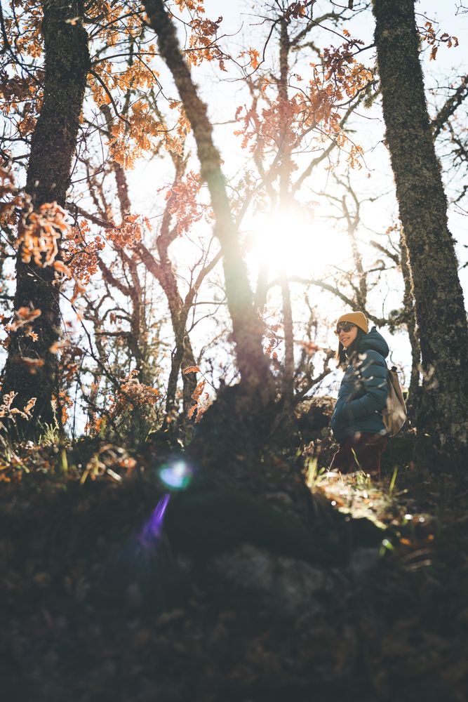 Woman walking in autumn forest