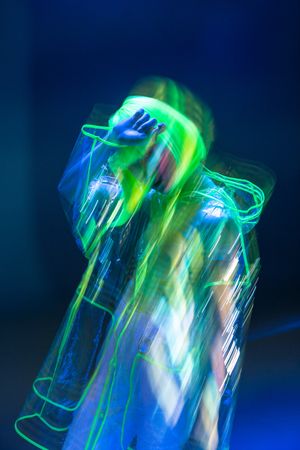 Asian woman posing in fluorescent light